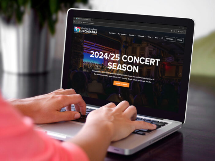 Woman viewing new Maryland Symphony Orchestra website on a laptop.